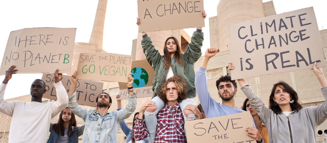 People with placards and posters on global strike for climate change. There is no planet B.